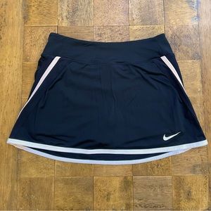 Nike black dry fit tennis skirt with white trim. Size S/P